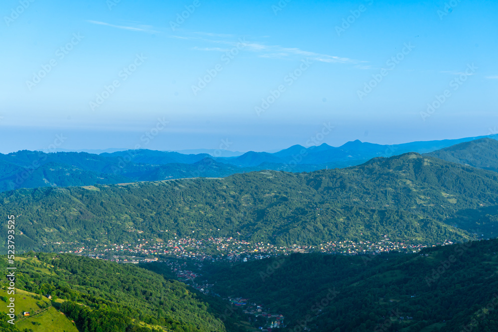 Sunrise over River Teresva and Dubove village from Apetska mountain, Carpathians mountains, Ukraine.