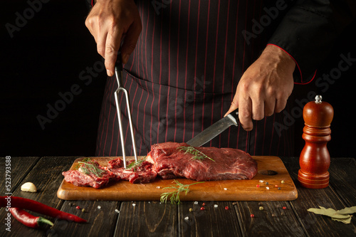 Cooking delicious veal by the chef hands in the kitchen. Menu idea for a restaurant or hotel