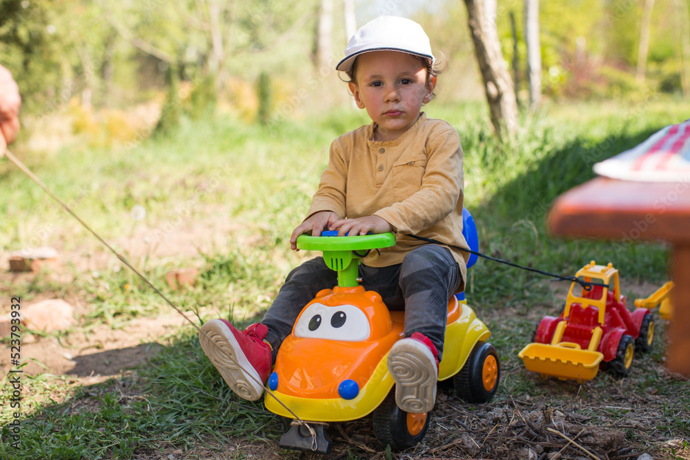 little child playing with toy car little child playing with toy car