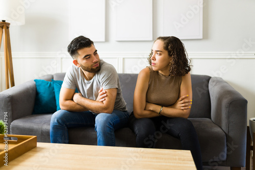 Annoyed woman and man arguing about their relationship problems