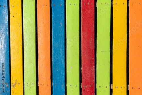 Colorful wooden boardwalk. Wooden boards. Empty space, for text or logo