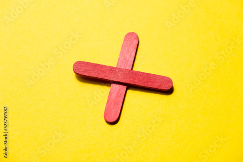 red cross on yellow background top view