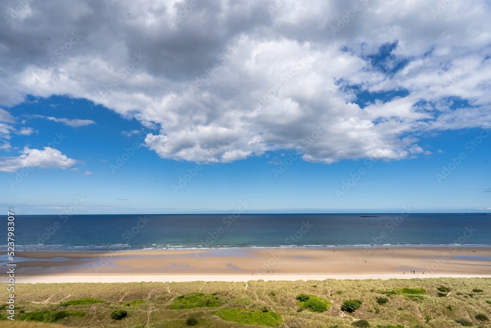beach and clouds, tricolour of the sea, sandy beach and the field, background with copy space beach and clouds, tricolour of the sea, sandy beach and the field, background with copy space