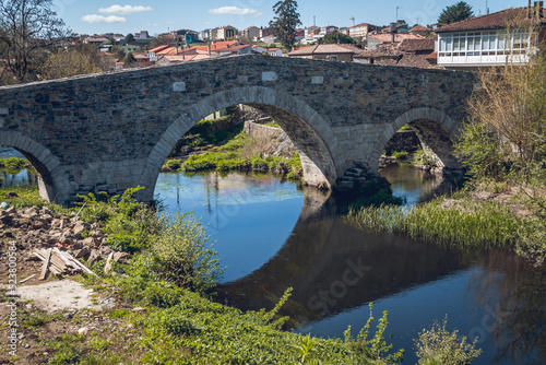 Historic stone bridge near Mellid, Galicia, Spain photo