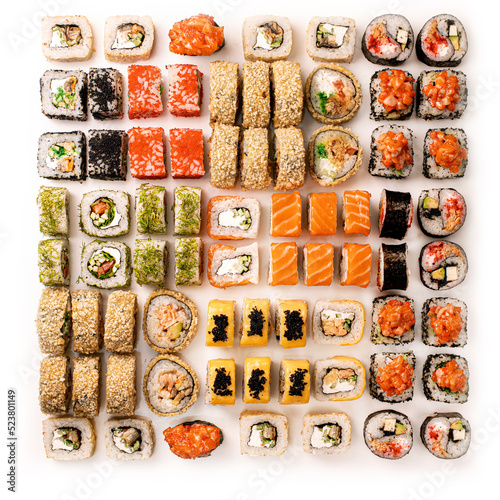 Big colorful sushi set on a white background. Top view.