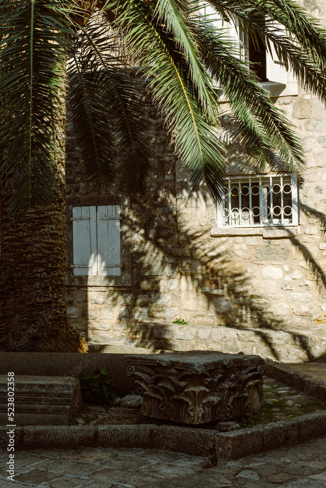 Beautiful street on a sunny day in the old town of Budva, Montenegro. Travel destination in Montenegro. Beautiful street on a sunny day in the old town of Budva, Montenegro. Travel destination in Montenegro.