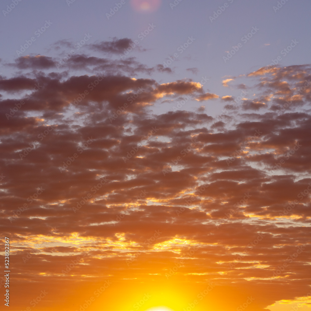 Evening orange sky with clouds, twilight sunset