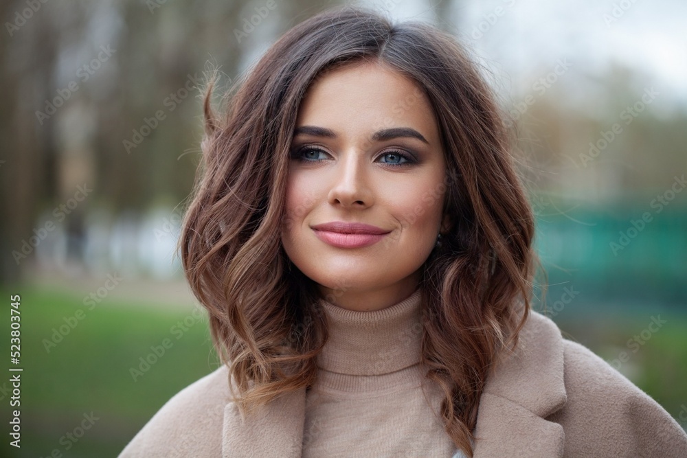 Carefree young woman brunette smiling, outdoor portrait Carefree young woman brunette smiling, outdoor portrait