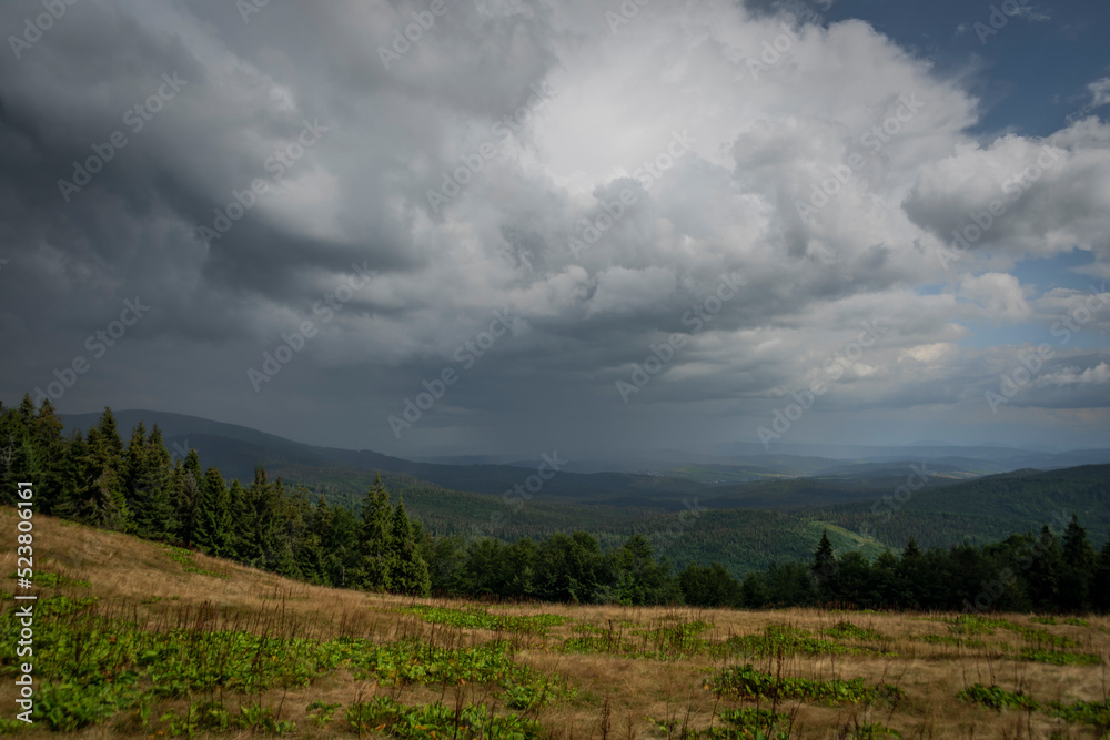 Summer stormy cloudy day in Zywiecki park Krajobrazowy with colorfull view