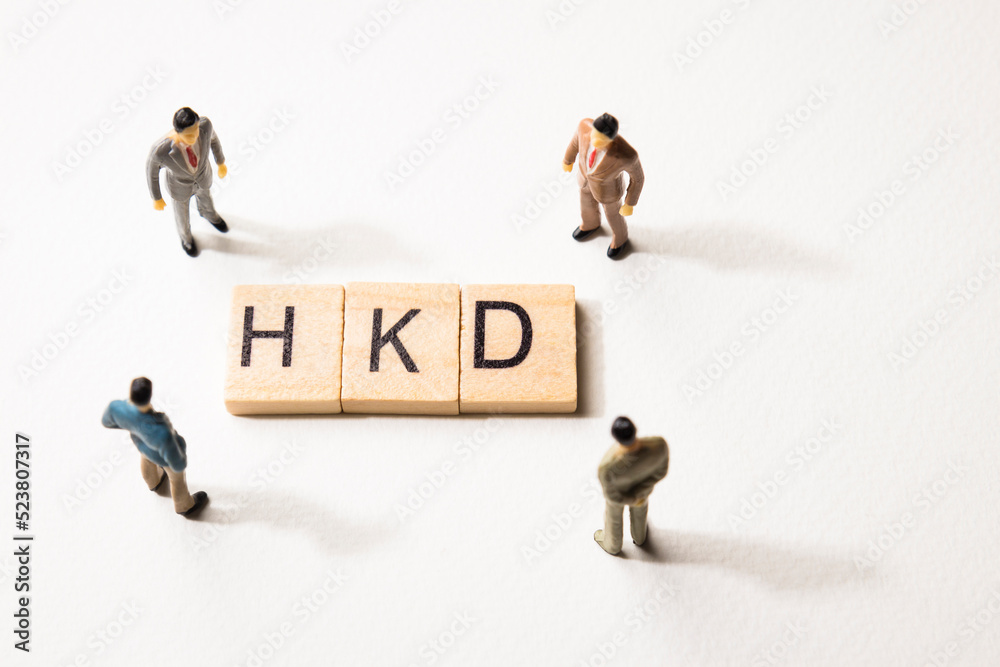 businessman figures at HKD words