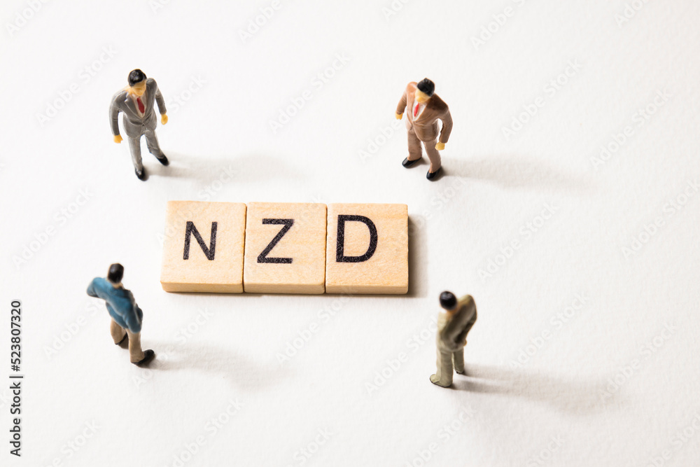 businessman figures at NZD words