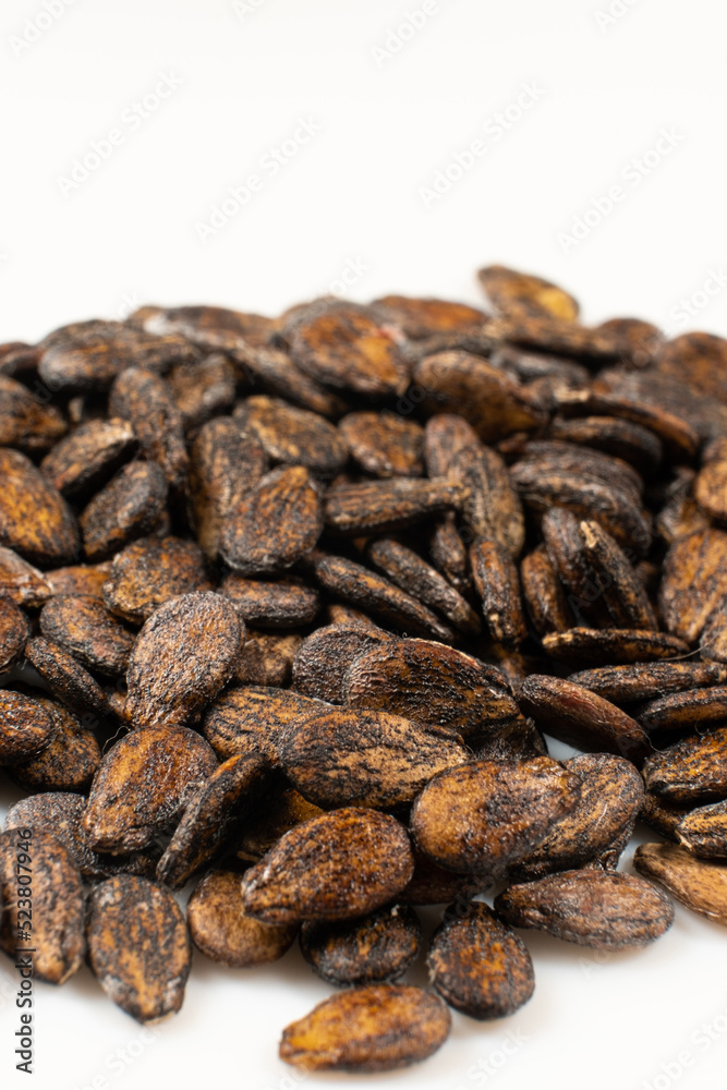 Dried watermelon seeds on a white background macro top view.
