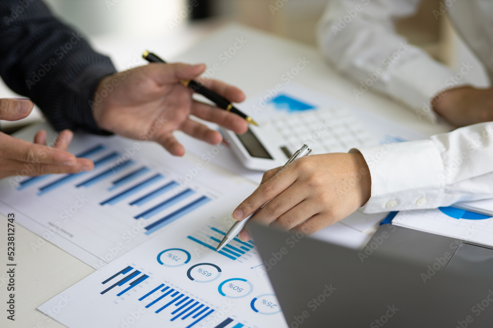 Meeting businessman and financial expert analyzing business report graph and finance budget chart in the office. Concept of finance economy, banking business and stock market research. Meeting businessman and financial expert analyzing business report graph and finance budget chart in the office. Concept of finance economy, banking business and stock market research.
