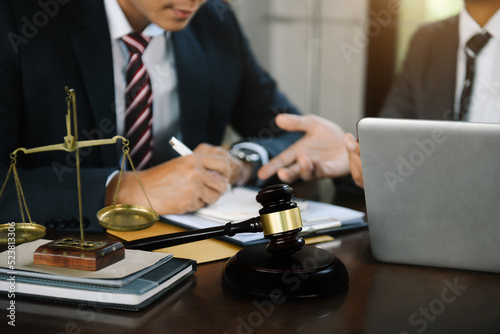 Lawyer business man working with paperwork on his desk in office workplace for consultant lawyer in office.