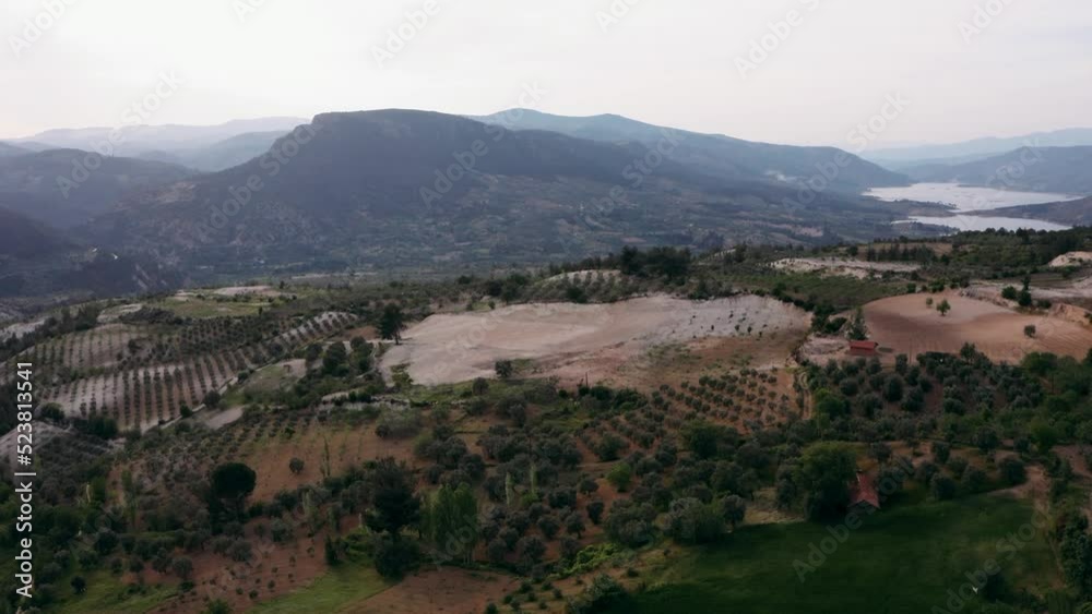 Aerial view of farmland in mountain area. Aerial view of olives, figs, grapes, plums, peaches, apricots, apples, trees and green fields. Drone view of different shades of green. Turkey Aerial view of farmland in mountain area. Aerial view of olives, figs, grapes, plums, peaches, apricots, apples, trees and green fields. Drone view of different shades of green. Turkey