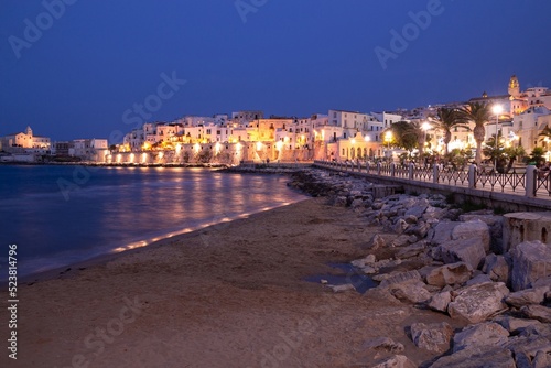 Vieste, Foggia, Italy 29 June 2021 View over historic old town on blue hour at Vieste, Gargano, Apulia, Italy