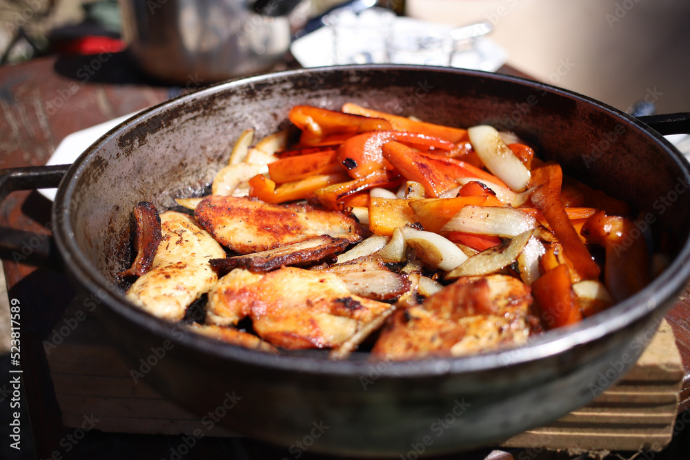 Pan with fried chicken and vegetables Pan with fried chicken and vegetables