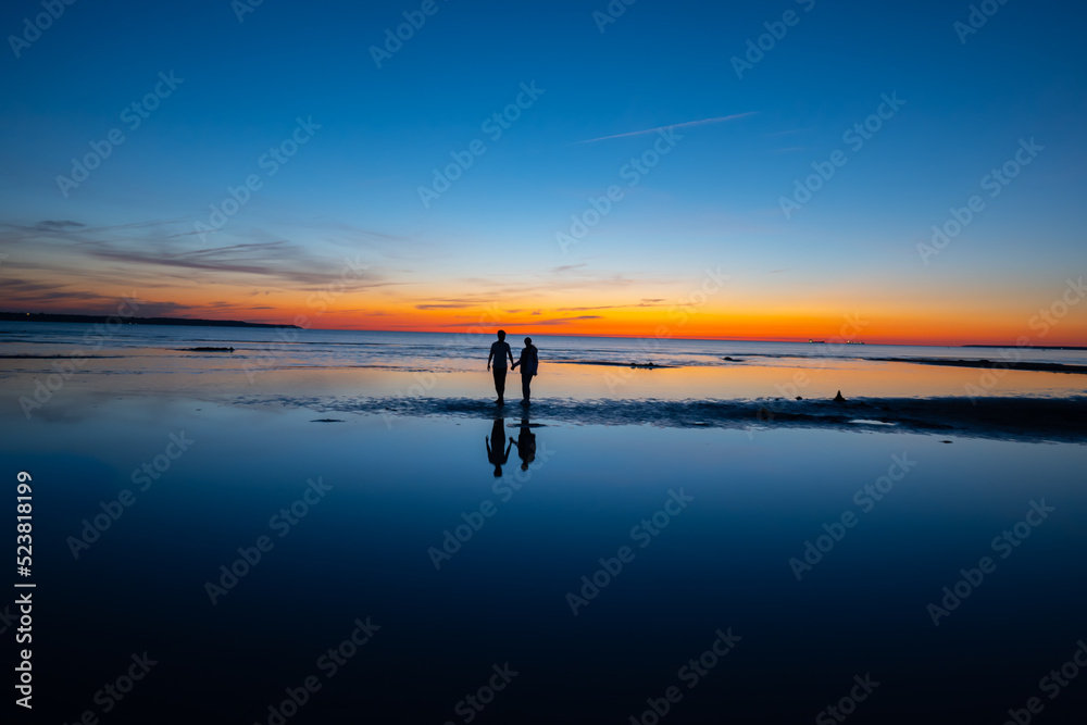 person on the beach at sunset person on the beach at sunset