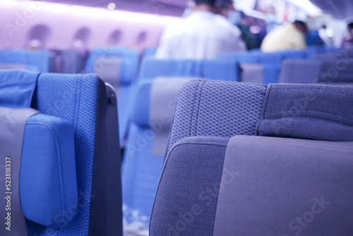 purple color Empty passenger airplane seats in the cabin