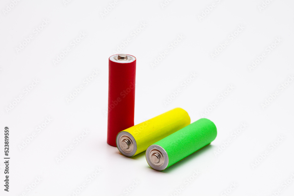 A group of red green yellow Lithium ion industrial high current batteries in white background A group of red green yellow Lithium ion industrial high current batteries in white background