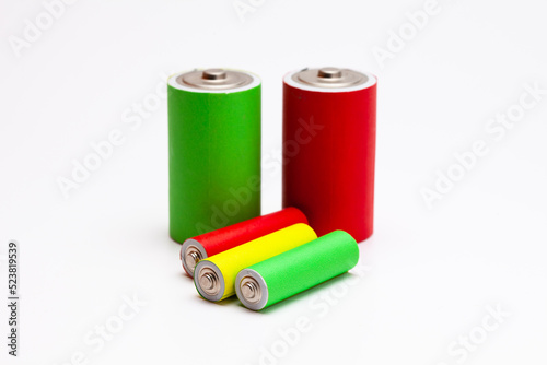 A group of red green yellow Lithium ion industrial high current batteries in white background