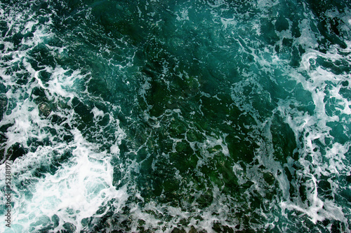 Aerial view to ocean waves.