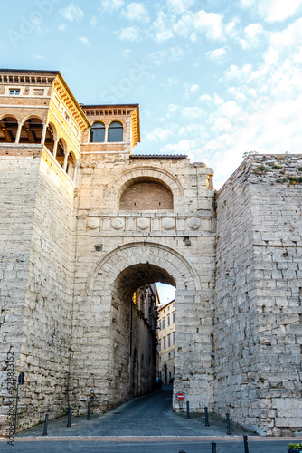The Etruscan Arch or Arch of Augustus or Augustus Gate (with Augusta Perusia written on the facade) is a gate in the Etruscan wall of Perusia, known today as Perugia in Umbria, Italy, Europe. photo