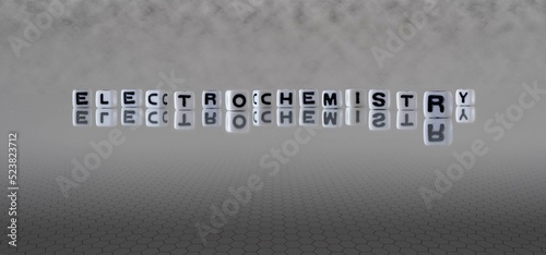 electrochemistry word or concept represented by black and white letter cubes on a grey horizon background stretching to infinity