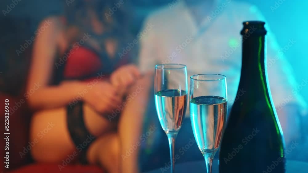 Woman flirting with man in strip club. Woman flirting with man in strip club.