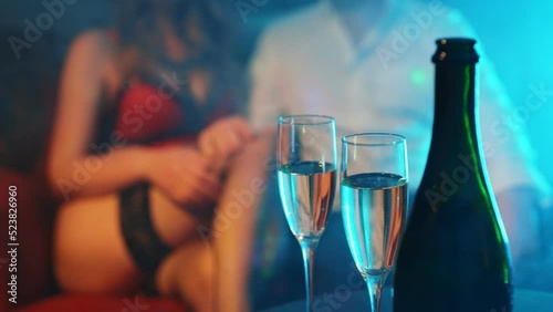 Woman flirting with man in strip club. photo