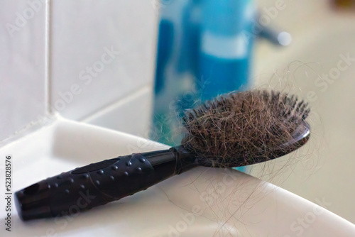 close-up of a hairbrush with lots of hair