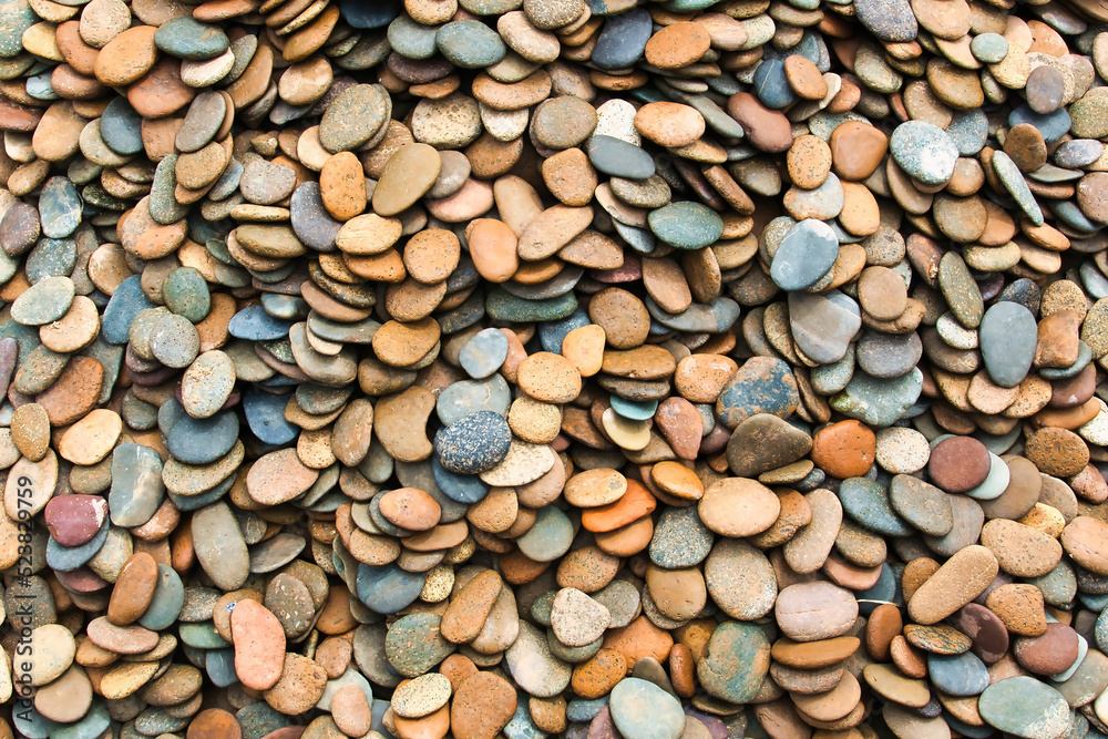 Pattern of smooth, rounded river stones. Background of smooth stones in soft colours
Pattern of smooth, rounded river stones. Background of smooth stones in soft colours