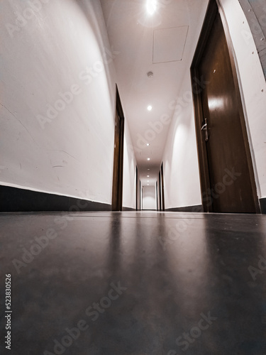 Interior of a simple minimalist hotel corridor.
