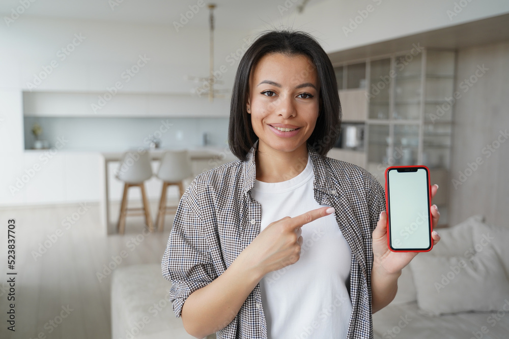 Woman points to phone screen with copy space. Mockup for smartphone advertising banner. Woman points to phone screen with copy space. Mockup for smartphone advertising banner.
