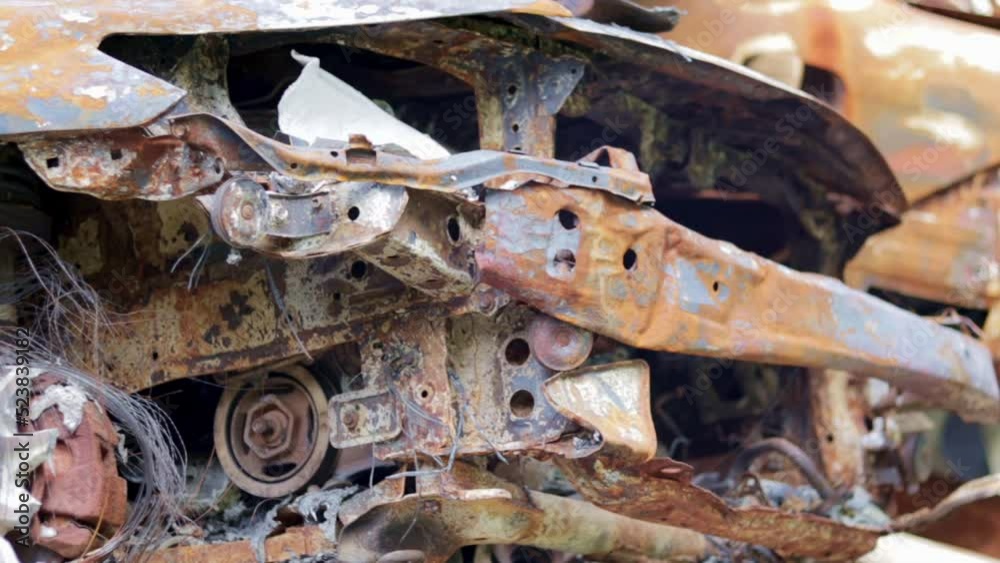 The car was completely destroyed by fire. Abandoned, burnt and rusty car by the road. The cars caught fire in the parking lot. Shrapnel and bullet holes in the burnt body. Cars after the fire. The car was completely destroyed by fire. Abandoned, burnt and rusty car by the road. The cars caught fire in the parking lot. Shrapnel and bullet holes in the burnt body. Cars after the fire.