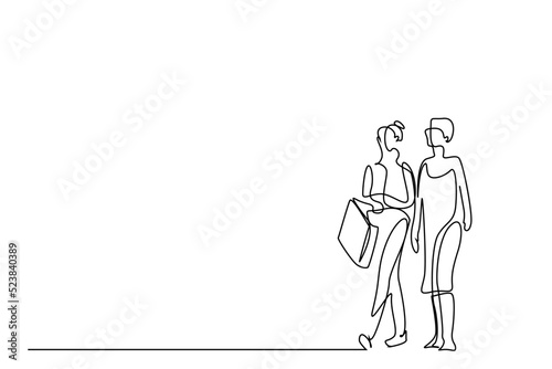 two girlfriends walking around stores with shopping bags in their hands