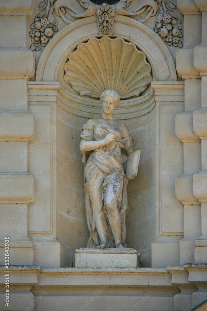 statue of an allegoric or mythologic character (muse ?)  in a castle in france 
