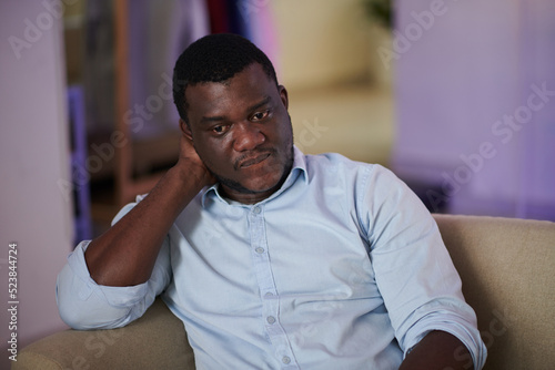 Portrait of pensive Black man pondering over his problems photo