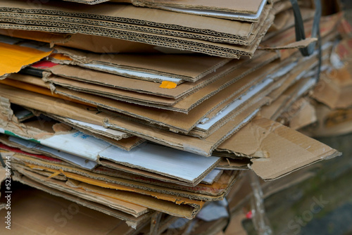 piles of used cardboard stacked for recycling