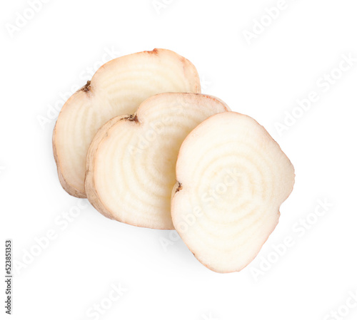 Pieces of sugar beet on white background