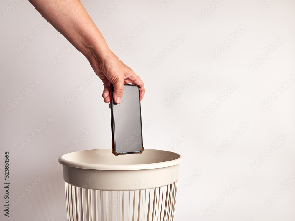The smartphone is thrown away for disposal and recycling The smartphone is thrown away for disposal and recycling