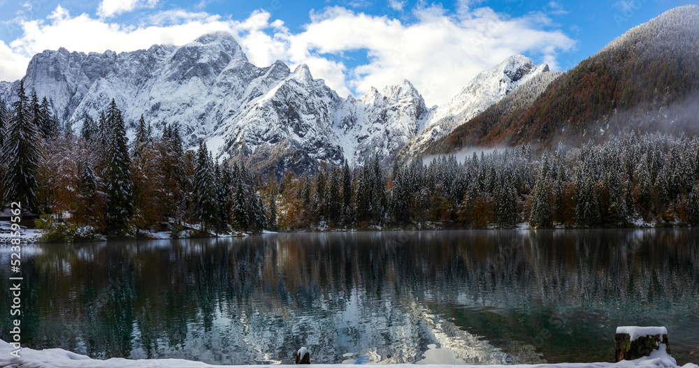Panoramic of Lower Fusine Alpine Lake in Julian Alps with Mount Mangart in Upper Center of the Photograph
