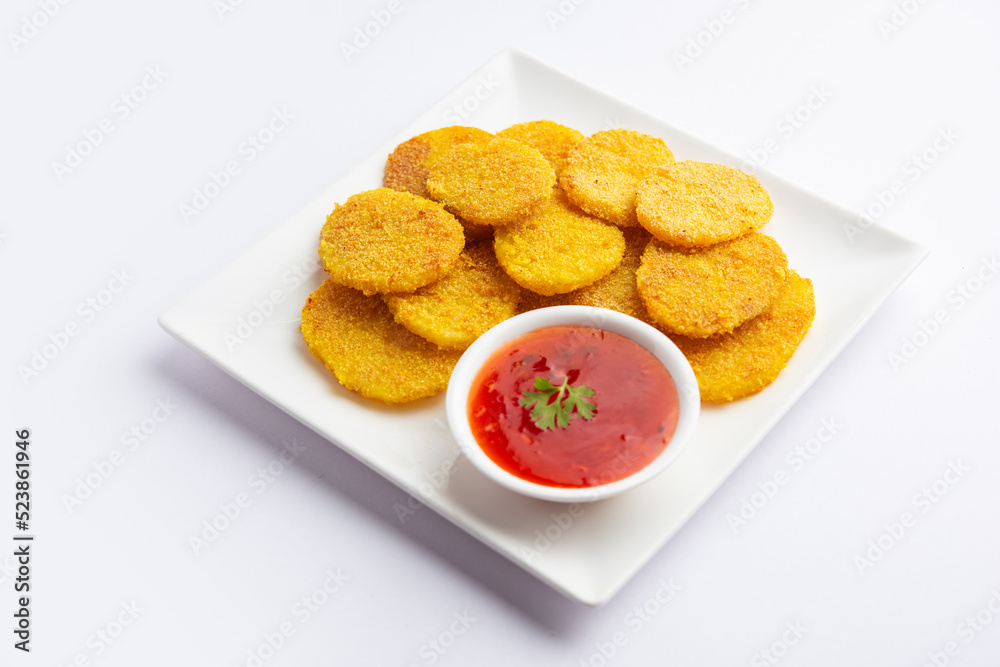 crispy potato rava fried slices or batatyache kaap or batata semolina fry snacks from India