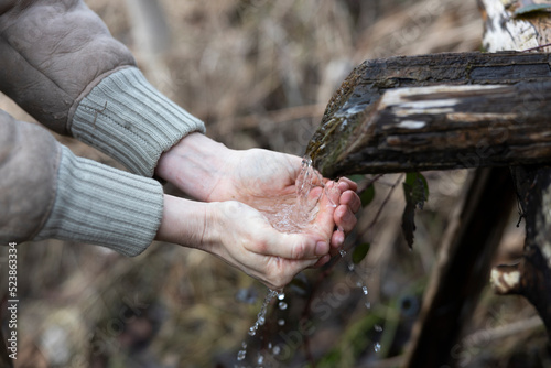 Washing Hands and Drinking Water From Natural Source Outdoors