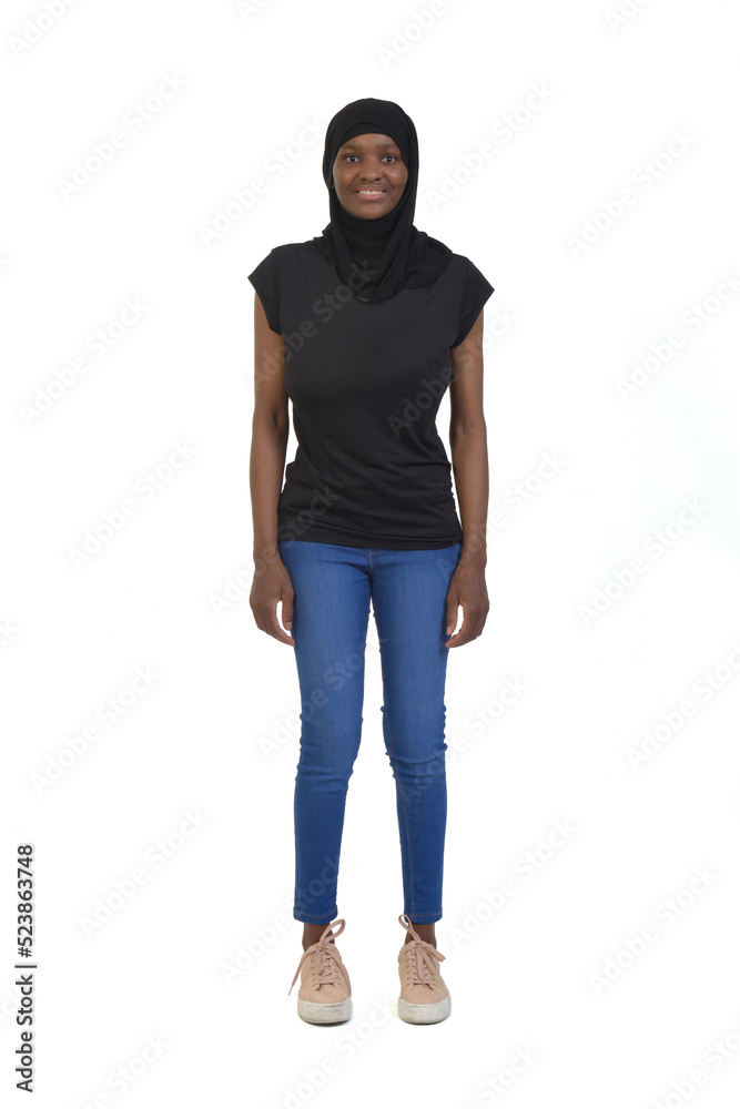 front view of a full portrait of a woman with burka jeans and sneakers on white background front view of a full portrait of a woman with burka jeans and sneakers on white background