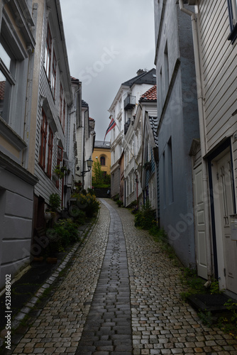 Idyllic small street (Knosesmauet) with colorful traditional wooden houses, Bergen, Norway © nielsvos