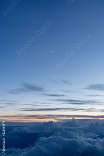 Moon above the clouds at dusk - Portrait  © Mustard Assets