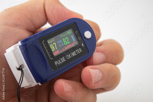 A blue pulse oximeter on the isolated white background