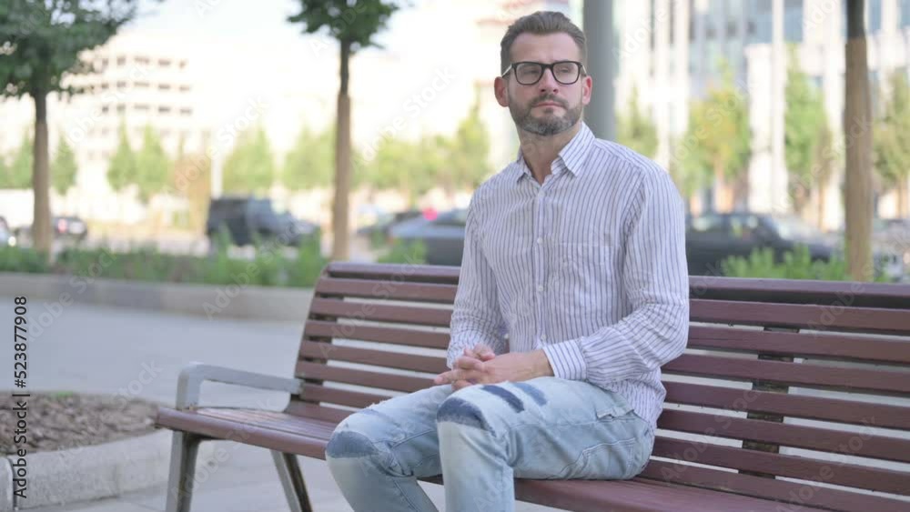 Young Adult Man standing and Leaving after Sitting on Bench Outdoor Young Adult Man standing and Leaving after Sitting on Bench Outdoor