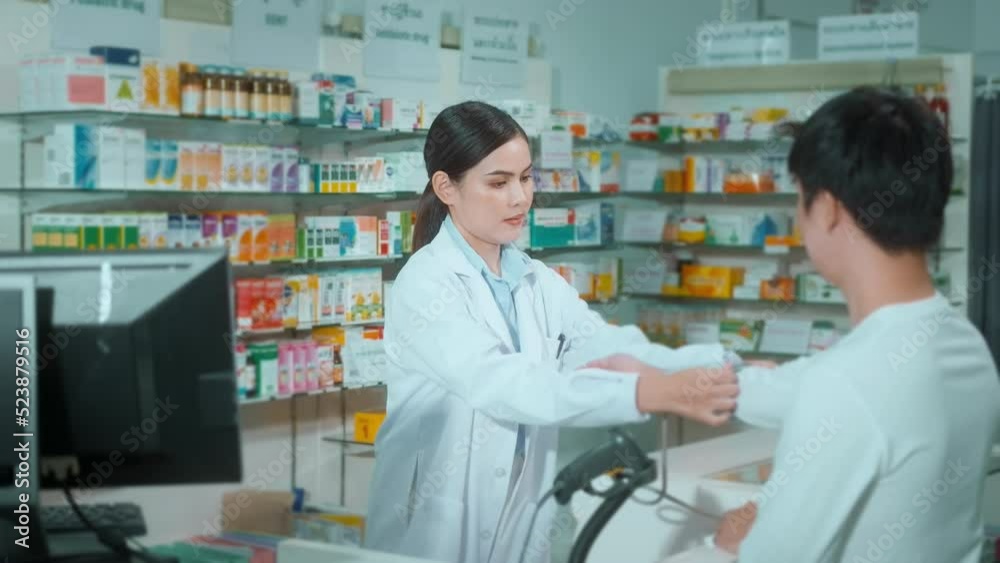 Female pharmacist counseling customer about drugs usage in a modern pharmacy drugstore. Female pharmacist counseling customer about drugs usage in a modern pharmacy drugstore.